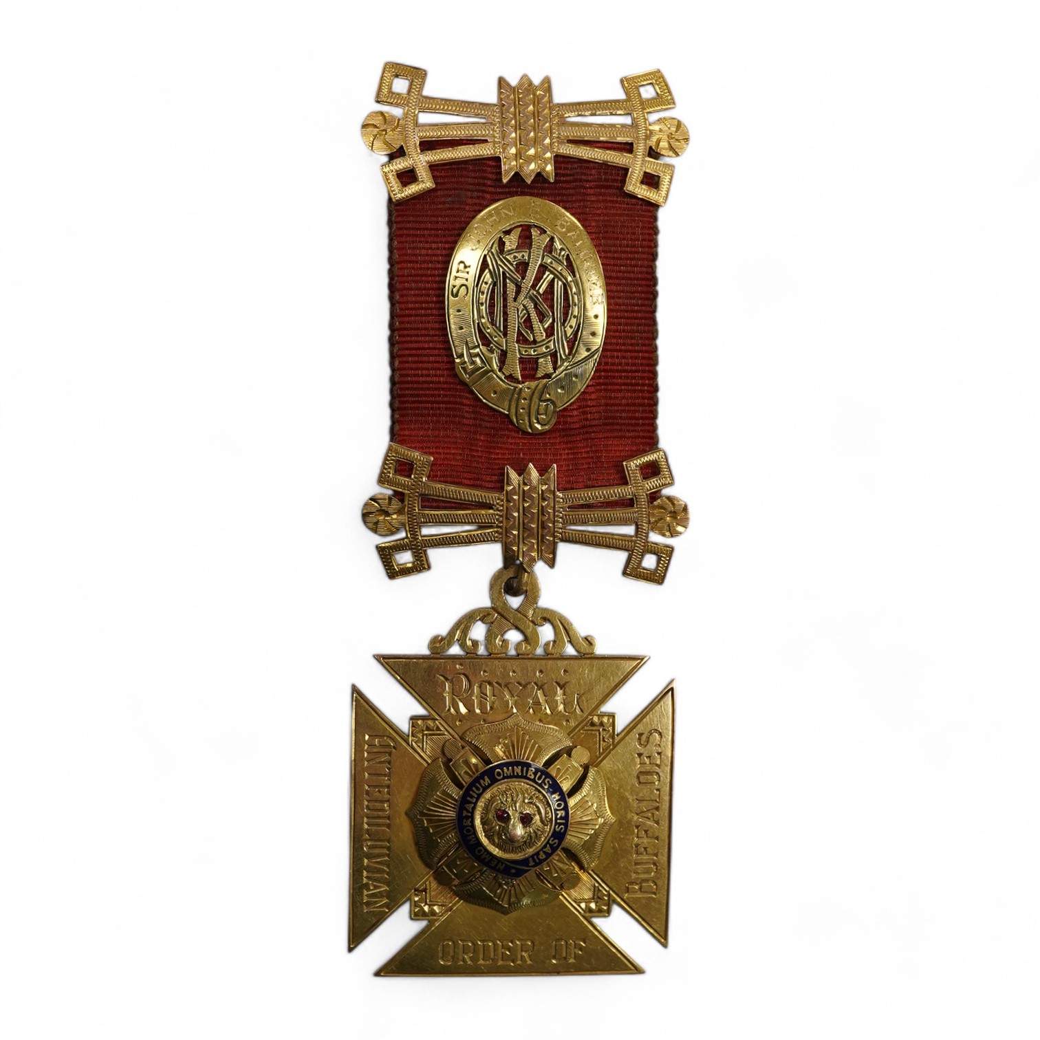 A 9ct gold Masonic 'Royal Order of Antedeluvian Buffaloes' medal, circa 1949, designed as a Maltese cross centring on a buffalo's face with garnet eyes, within a blue enamel garter border, inscribed 'Royal Order of Anted